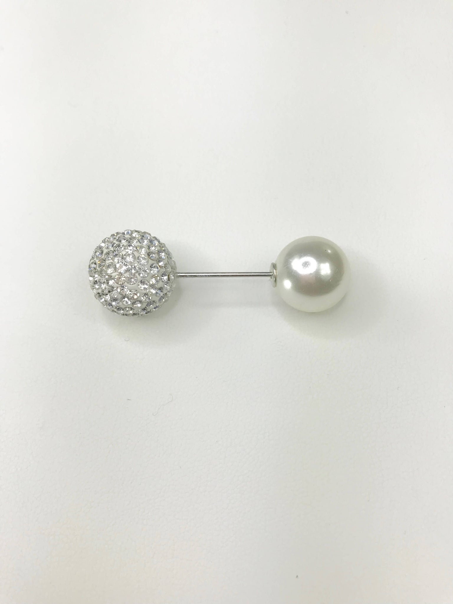 Crystal and pearl accent pin brooch with a sleek silver-tone bar, featuring a crystal-encrusted sphere and a luminous faux pearl with a screwable closure for secure attachment.