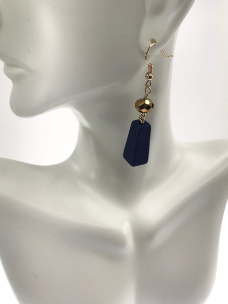 Close-up of a navy blue dangle earring Vibrant Fiesta Flair Set with multicolored beaded statement necklace and matching lightweight fishhook earrings - playful jewelry collection.