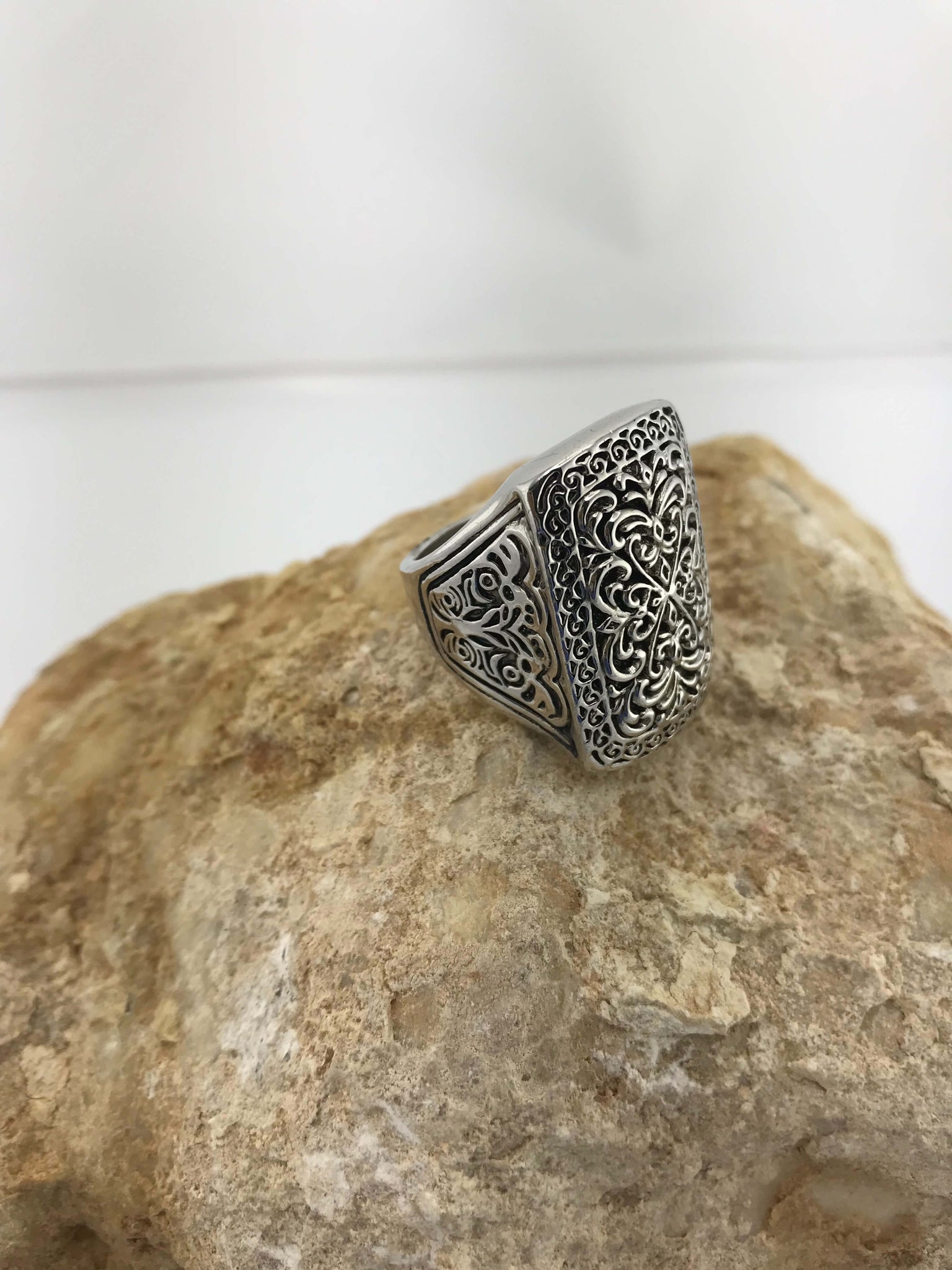 Handcrafted sterling silver ring with intricate filigree details and scratch-resistant vintage finish. Elegant, timeless statement piece for any occasion.