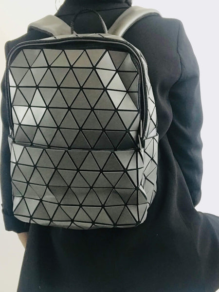 Charcoal Cosmos Backpack with bold triangle designs, interior zipper, and trendy style for everyday utility and adventure.