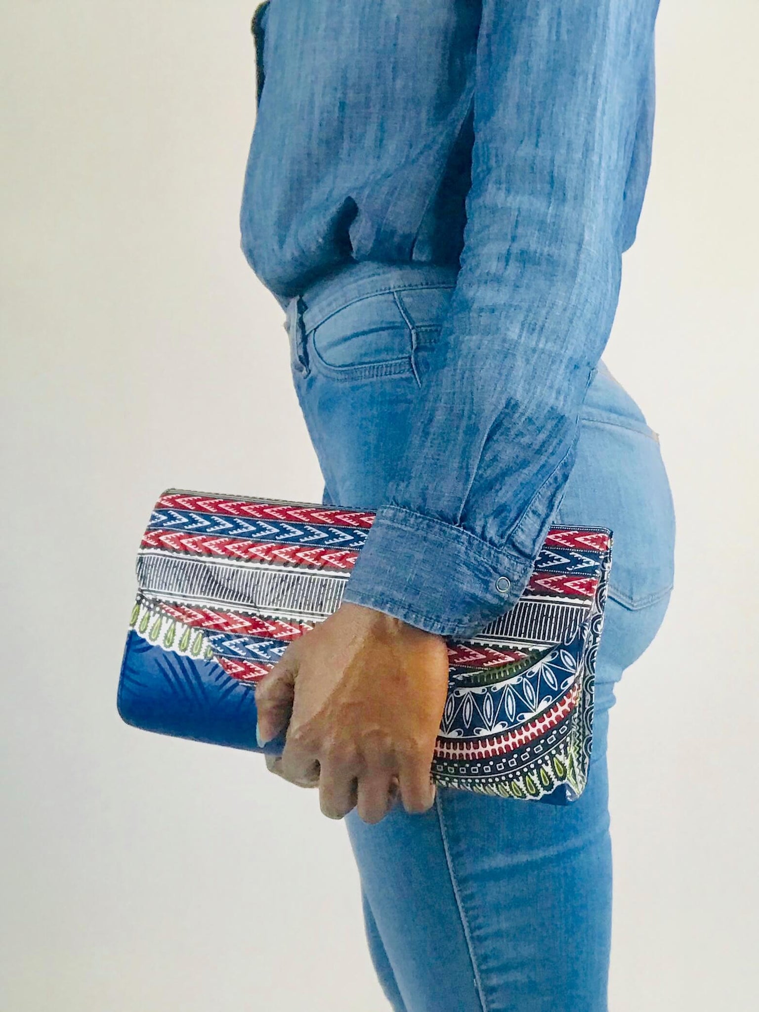 Handmade African print clutch with bold colors and playful design, perfect as a statement accessory for any adventure.