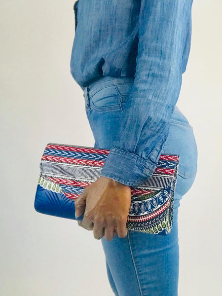 Handmade African print clutch with bold colors and playful design, perfect as a statement accessory for any adventure.
