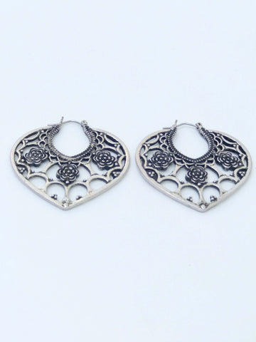 Bohemian-inspired heart-shaped earrings with intricate design, perfect for a stylish and unique look.