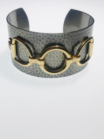 Hammered Metallic Cuff Bracelet with a textured gunmetal finish and gold-tone horse bit accents, adjustable for a timeless and elegant statement accessory