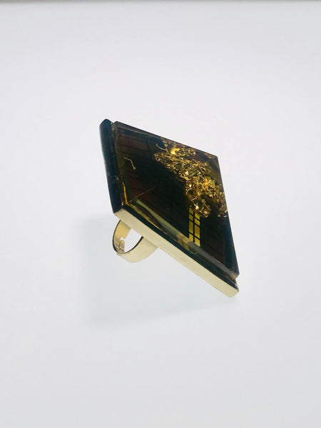 Pyramid-shaped ring with a gold fleur-de-lis center, bold geometric patterns, nickel-free, adjustable, and perfect for any occasion.