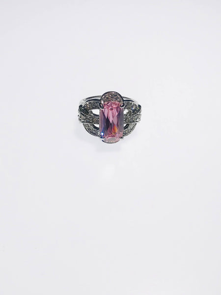 Radiant pink gemstone ring with diamond accents, crafted with durable Ed-Force for elegance, scratch resistance, and lasting brilliance