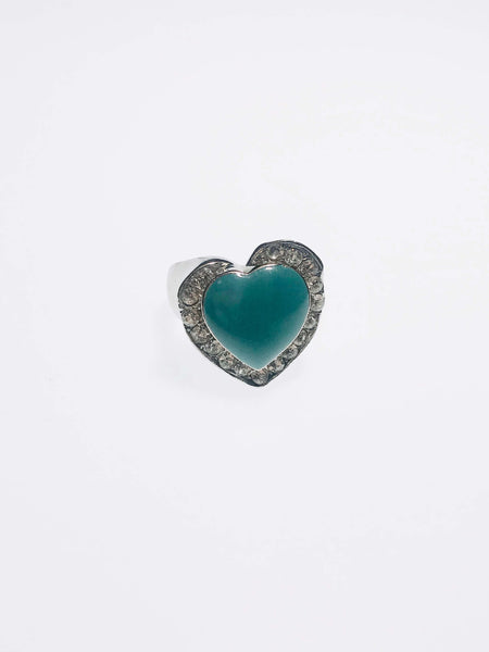 Heart-shaped turquoise ring with crystal halo. Crafted with scratch-resistant Ed-Force metal for elegance and durability.