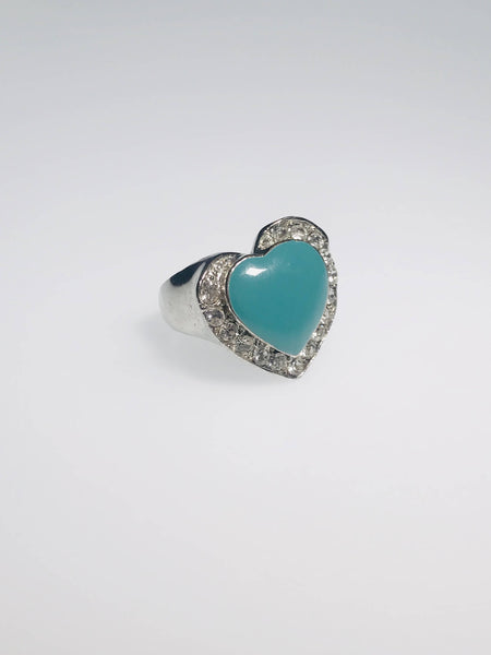 Heart-shaped turquoise ring with crystal halo. Crafted with scratch-resistant Ed-Force metal for elegance and durability.