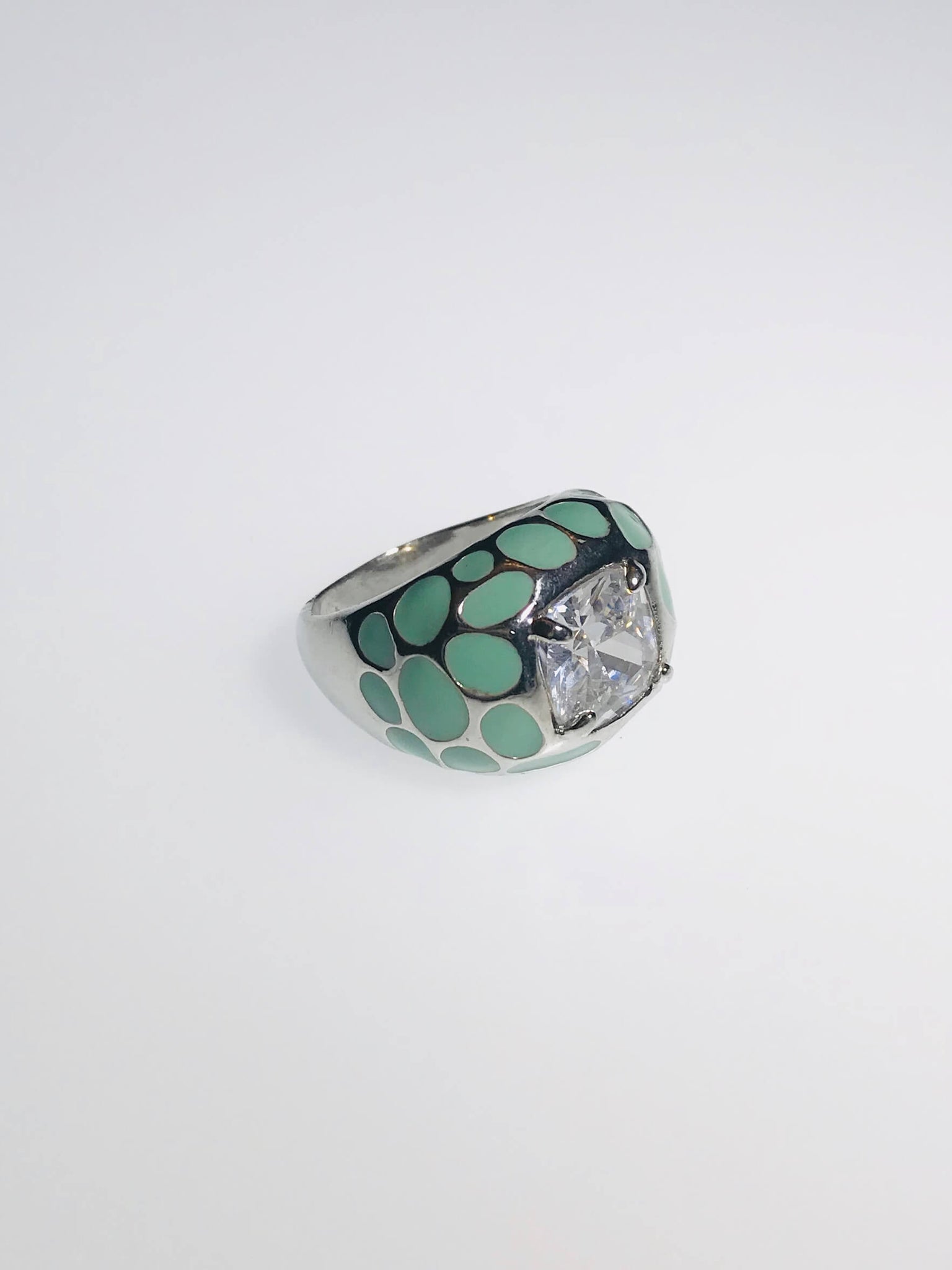 AquaLuxe Spark Ring featuring a square-cut crystal, seafoam green enamel, and silver-tone design. Elegant and modern statement jewelry.