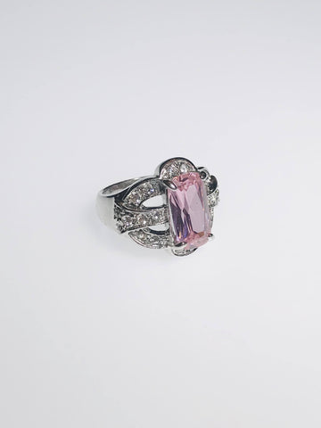 Radiant pink gemstone ring with diamond accents, crafted with durable Ed-Force for elegance, scratch resistance, and lasting brilliance