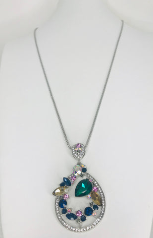 Pendant necklace with multicolored gemstones, teardrop design, and sterling silver halo for a vibrant and elegant look.
