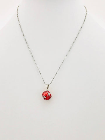 Stunning red crystal pendant necklace with a radiant scarlet gem in a scratch-resistant silver-tone design, perfect for any outfit.