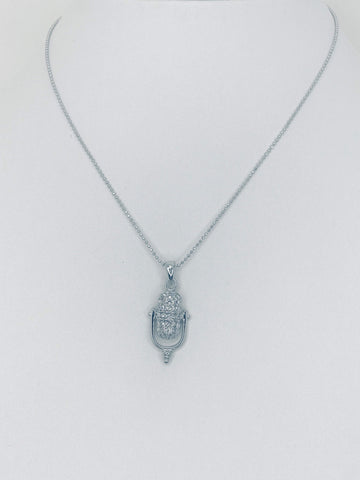 Microphone pendant necklace with sparkling crystals, retro design, and scratch-resistant durability. Perfect for music enthusiasts.