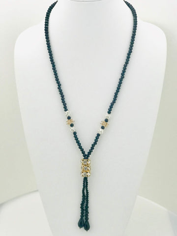 Dual-layer black bead and gold chain necklace with elegant four-leaf clover charms, perfect for day-to-night looks and modern elegance.