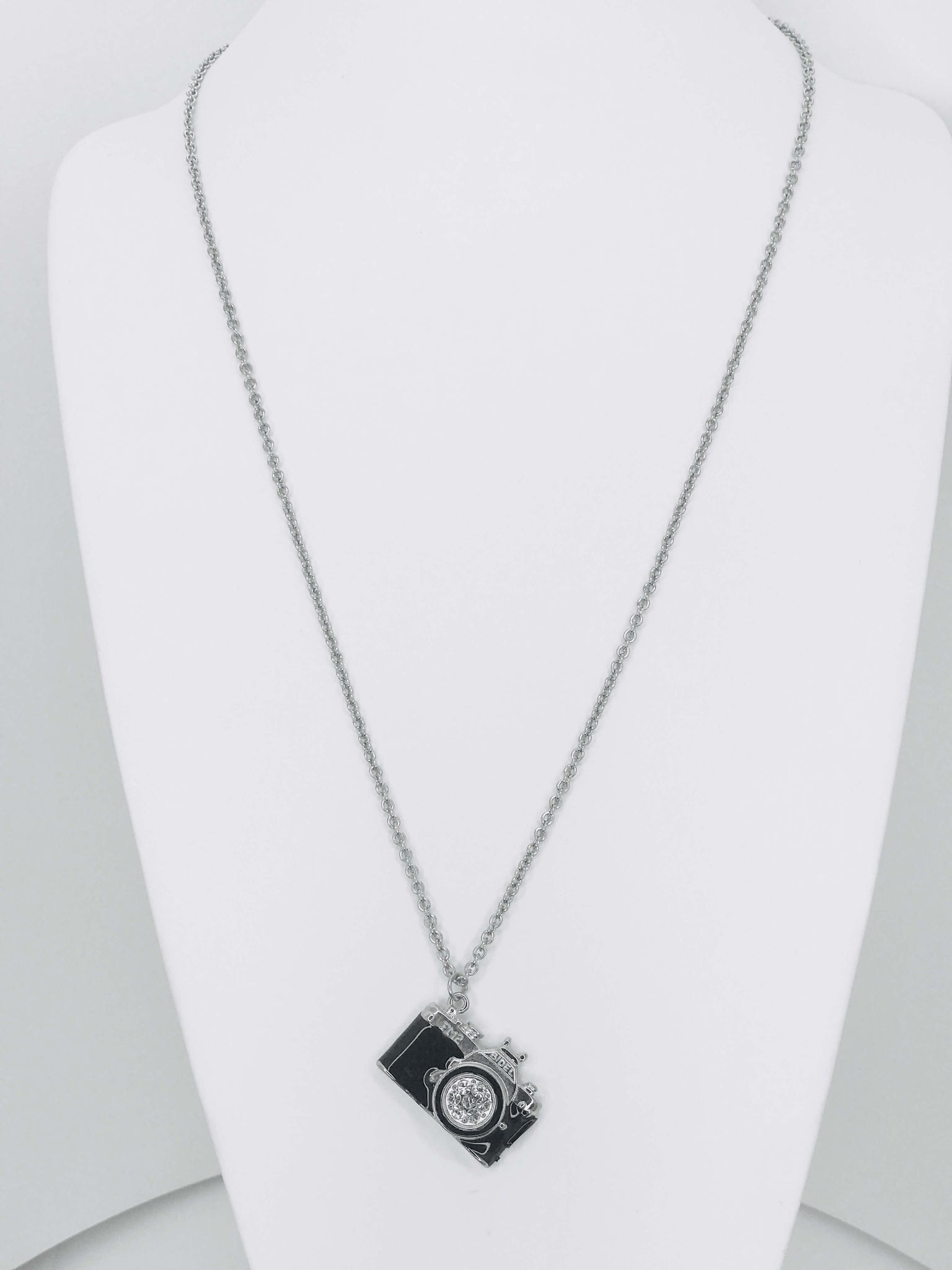 Camera charm necklace with sparkling rhinestone lens. Lightweight, durable, and perfect for photographers or daily wear.