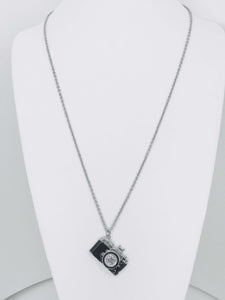 Camera charm necklace with sparkling rhinestone lens. Lightweight, durable, and perfect for photographers or daily wear.